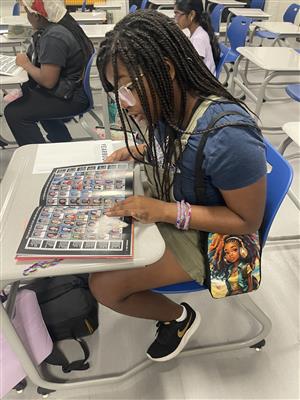 Students looking through the old yearbooks